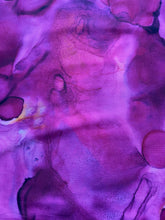 Load image into Gallery viewer, Alchemy fabric by Tim Holtz for Free Spirit is a collection of fabrics that features vivid hues and deep, rich undertones. The collection is inspired by the fluid movement created by using alcohol ink. This selection is a purple in violet colors.
