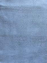 Load image into Gallery viewer, Crackle Wideback by Northcott is a collection of 108&quot; wide quilt backing fabrics that are perfect for creating stunning quilts. The Crackle fabric features a neutral crackle design in shades of snow, and bamboo from the Crackle collection is a beautiful grey color that can be used to create unique and beautiful pieces of art. The fabric is made of 100% cotton and is machine washable. 
