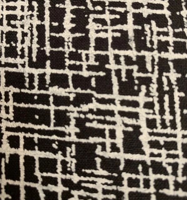 Fit for a Queen Wideback in Betula is a luxurious 100% cotton quilt backing fabric. this one is white crosshatch on black background