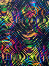 Load image into Gallery viewer, Circle Play by Henry Glass Fabrics is a collection of 108&quot; wide quilt backing fabrics that are perfect for creating stunning quilts. The Circle Play fabric features a variety of designs in different colors, including black with multicolored swirls 12. The fabric is made of 100% cotton and is machine washable. This one comes in bright rainbow colors on a black background
