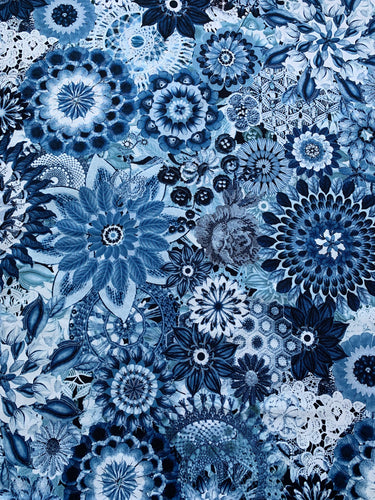  “Floral Crochet” Fabric by P&B Textiles: A kaleidoscope pattern resembling crocheted flowers in shades of aqua and coral on a 108-inch wide fabric. Perfect for quilt backings, duvet covers, tablecloths, and apparel projects. 